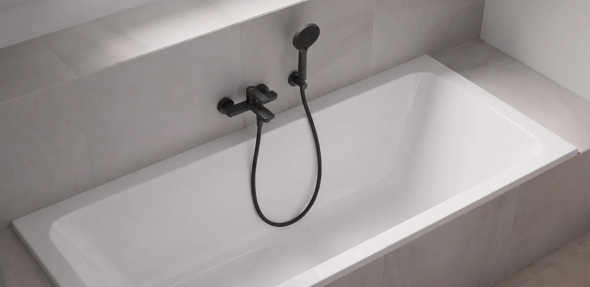A replaced bathtub with a tiled surround in a finished bathroom