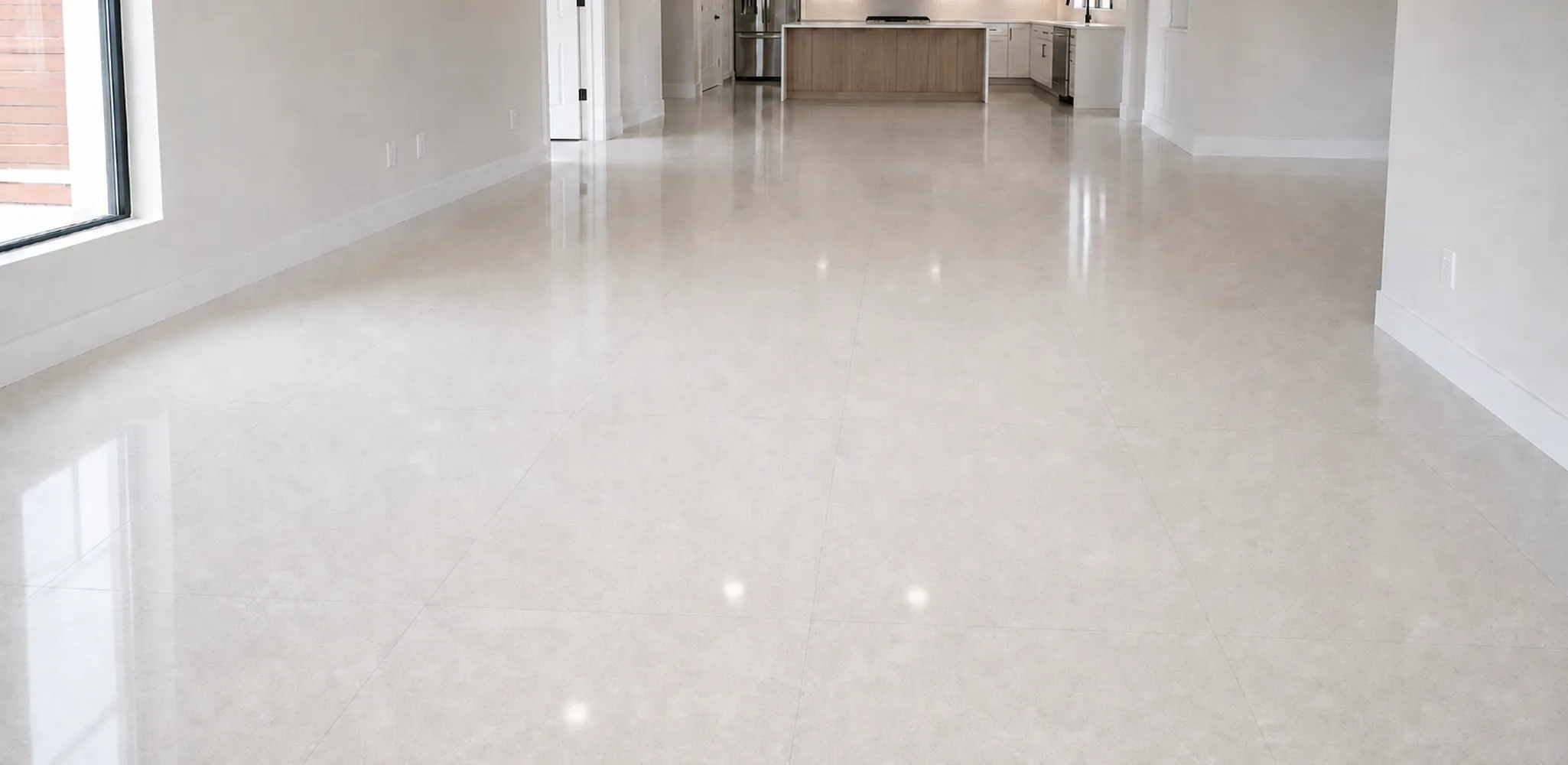 Large format floor tile running from the living room to the kitchen in Tampa, FL