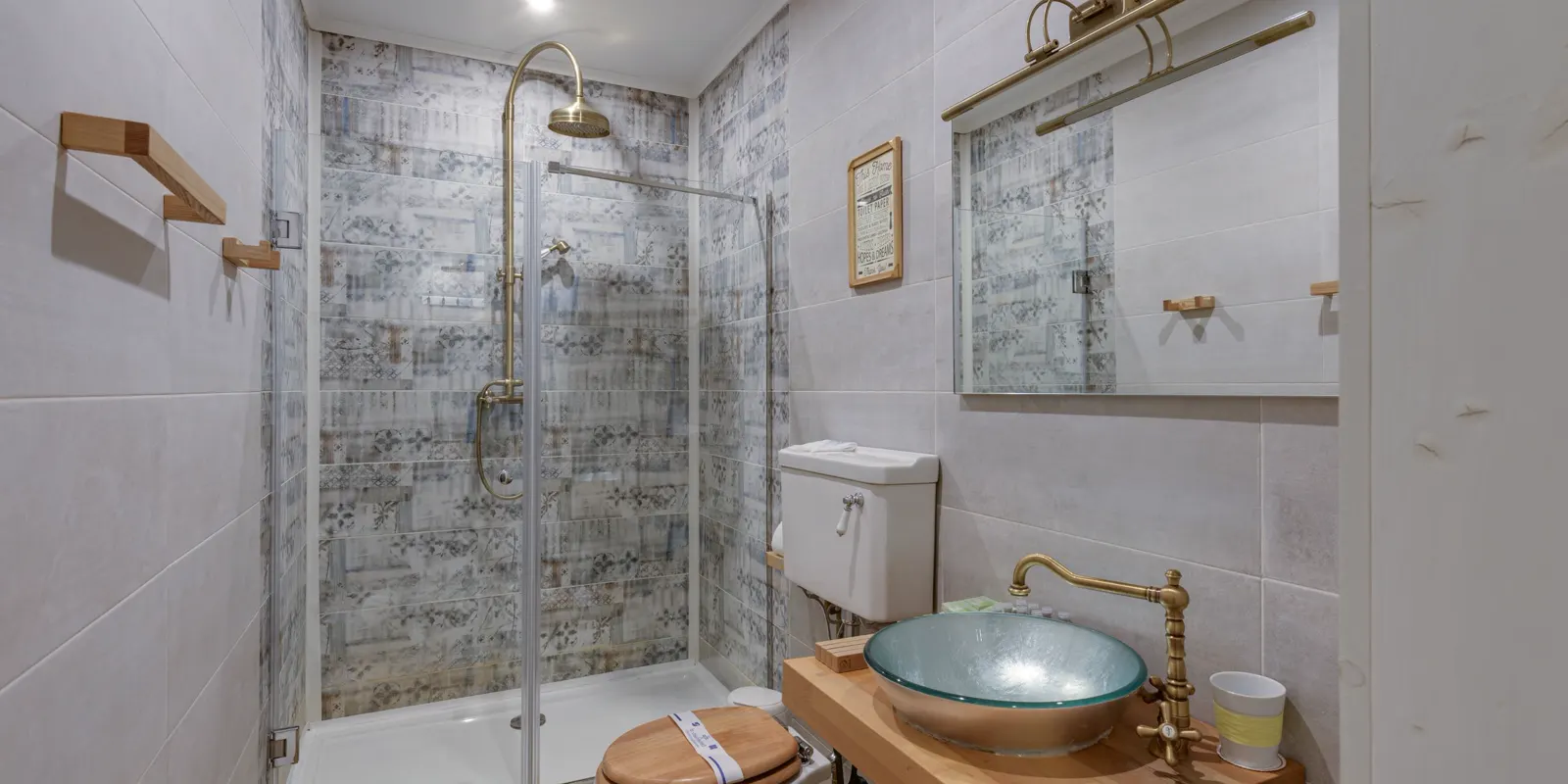 A small bathroom with a walk in shower and a compact vanity, small bathroom remodel